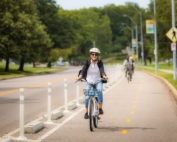 cyclists-riding-gillham-bike-lanes-smiling-800x500
