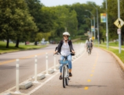 cyclists-riding-gillham-bike-lanes-smiling-800x500